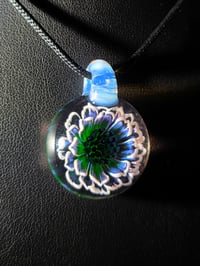 Image 1 of Uv reactive flower pendant..