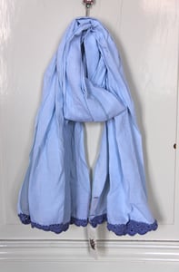 Image of lightblue shawl with crocheted ends