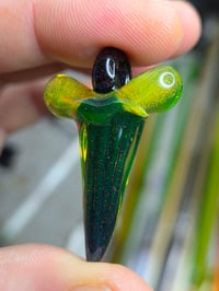 Image 1 of Fully uv reactive crushed opal glass shark tooth pendant. 