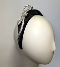 Image 1 of Black headband w diamanté bow. 