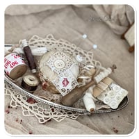 Image 1 of Handmade pin cushion sitting on a silver tray full of French sewing notions