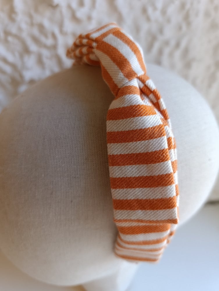 Image of Cerchietto a fiocco righe bianco/arancione