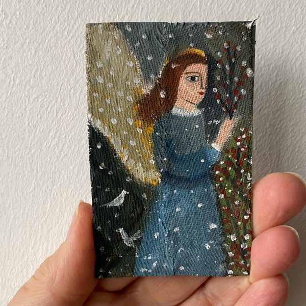 Image of Angel in a winter landscape (first snow) - tiny portrait 