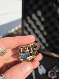 Image 4 of Mini electrum T-Rex skull pendant.