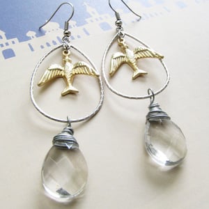 Image of doving over clear quartz earrings