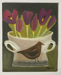 Tulips in a bird urn