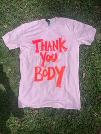 Image 2 of Thank You Body Shirt (MEDIUM) Pink with orange marbled  text.