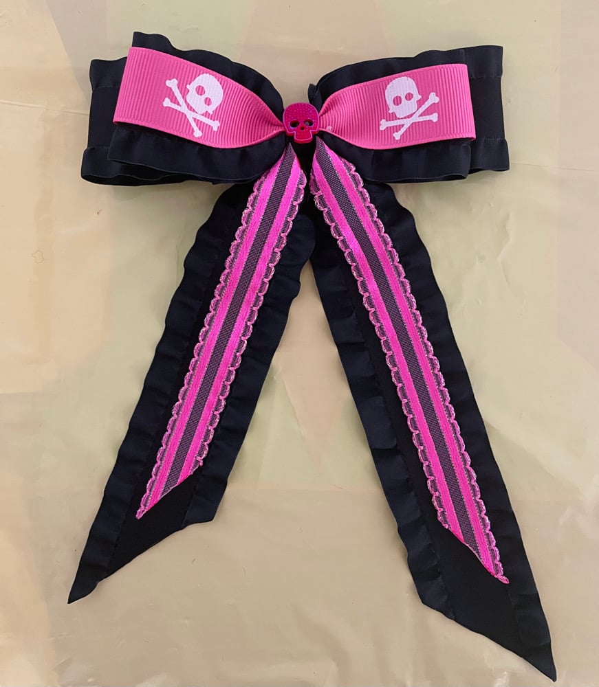 Pink and black skull bow with tails