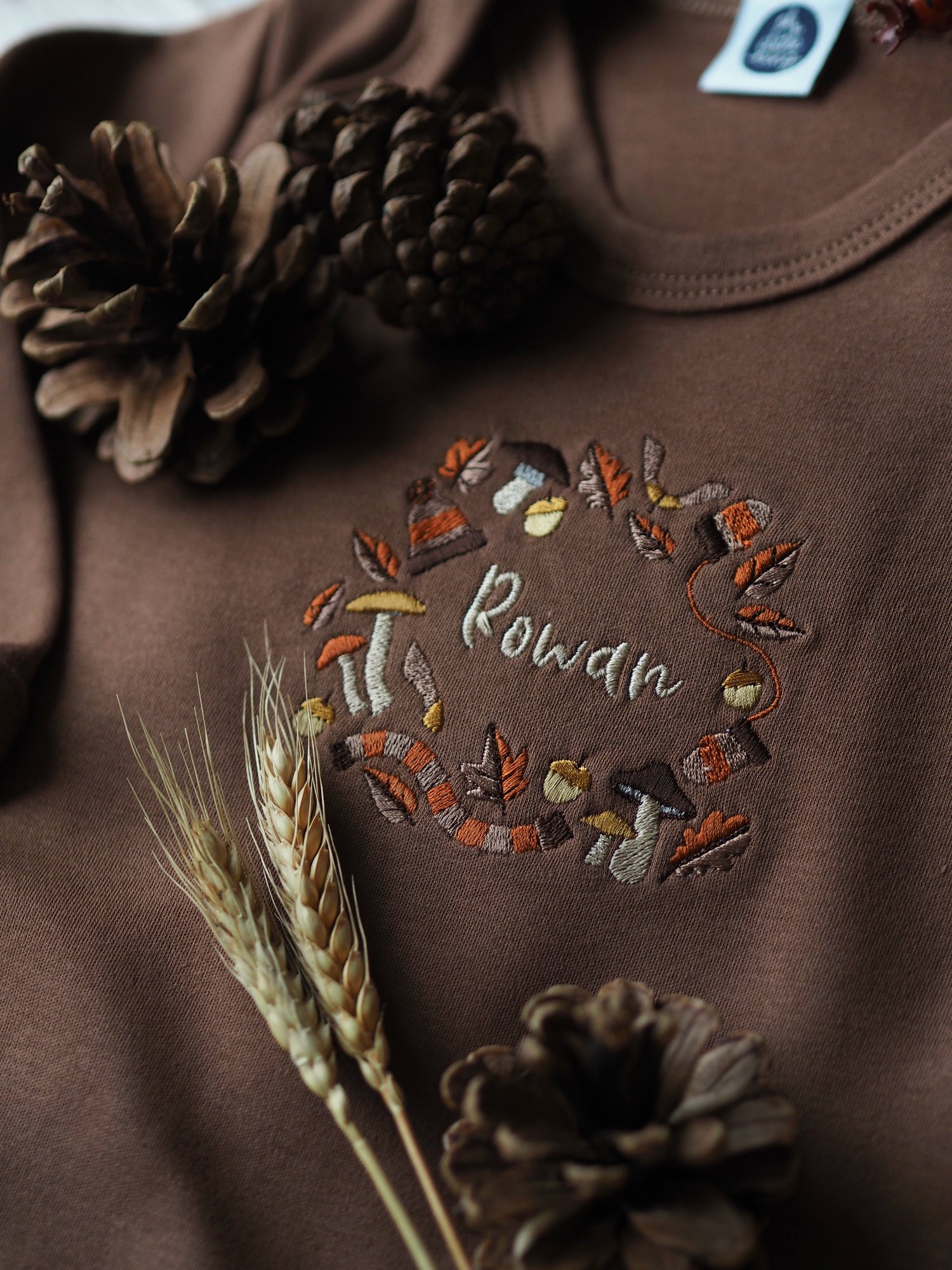 Image of A Rustling Stroll - Cinnamon sleepsuit