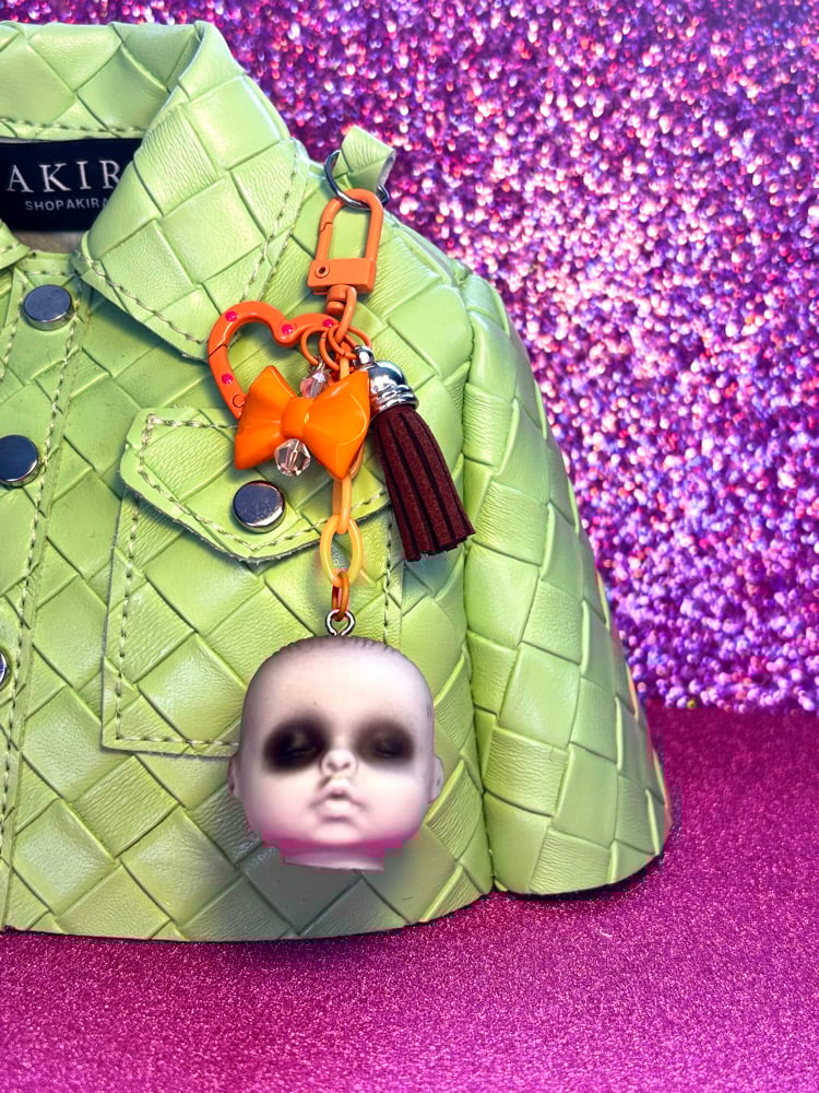 Image of Creepy Baby Doll Head Bag Charm Orange