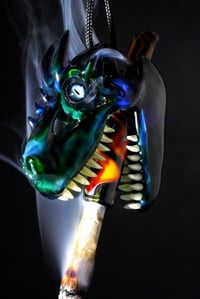 Image 1 of Dragon skull pendant with uv teeth & fire themed tip 🐲🔥