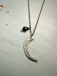 Image 1 of sterling silver moon pendant with brave inscription and green tourmaline