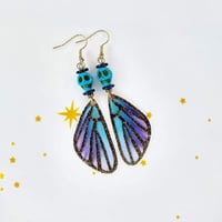 Image 4 of Skull + Wings Earrings