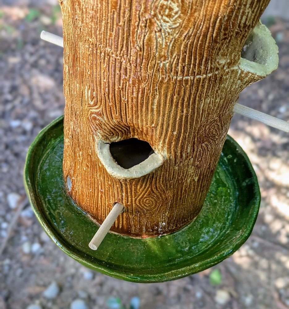 Image of handmade green and brown tall bird feeder 