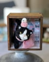 Pipe cleaner tuxedo kitten with its magnetic wooden display 