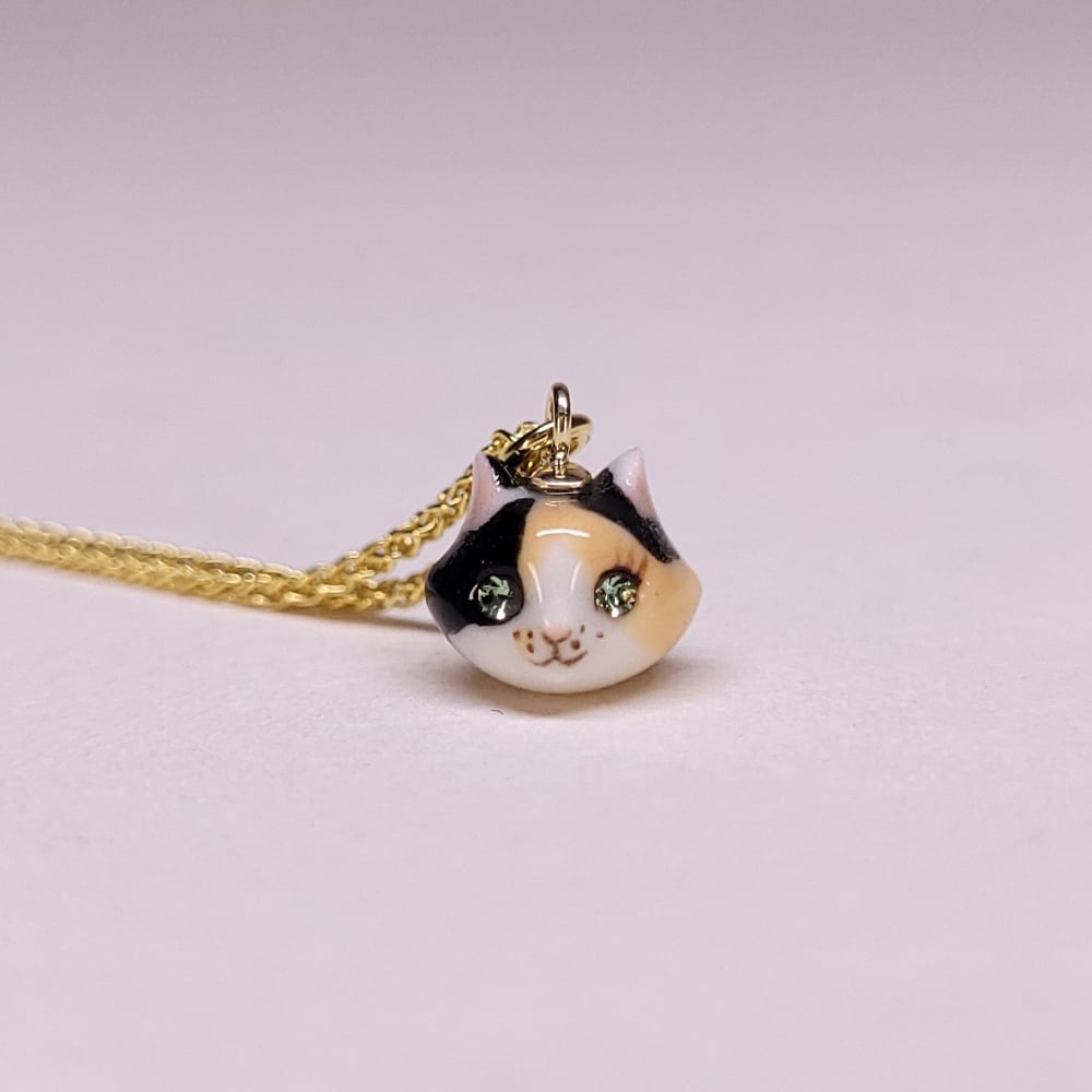 Image of Calico Porcelain & Gold Vermeil Teeny Tiny Cat Pendant