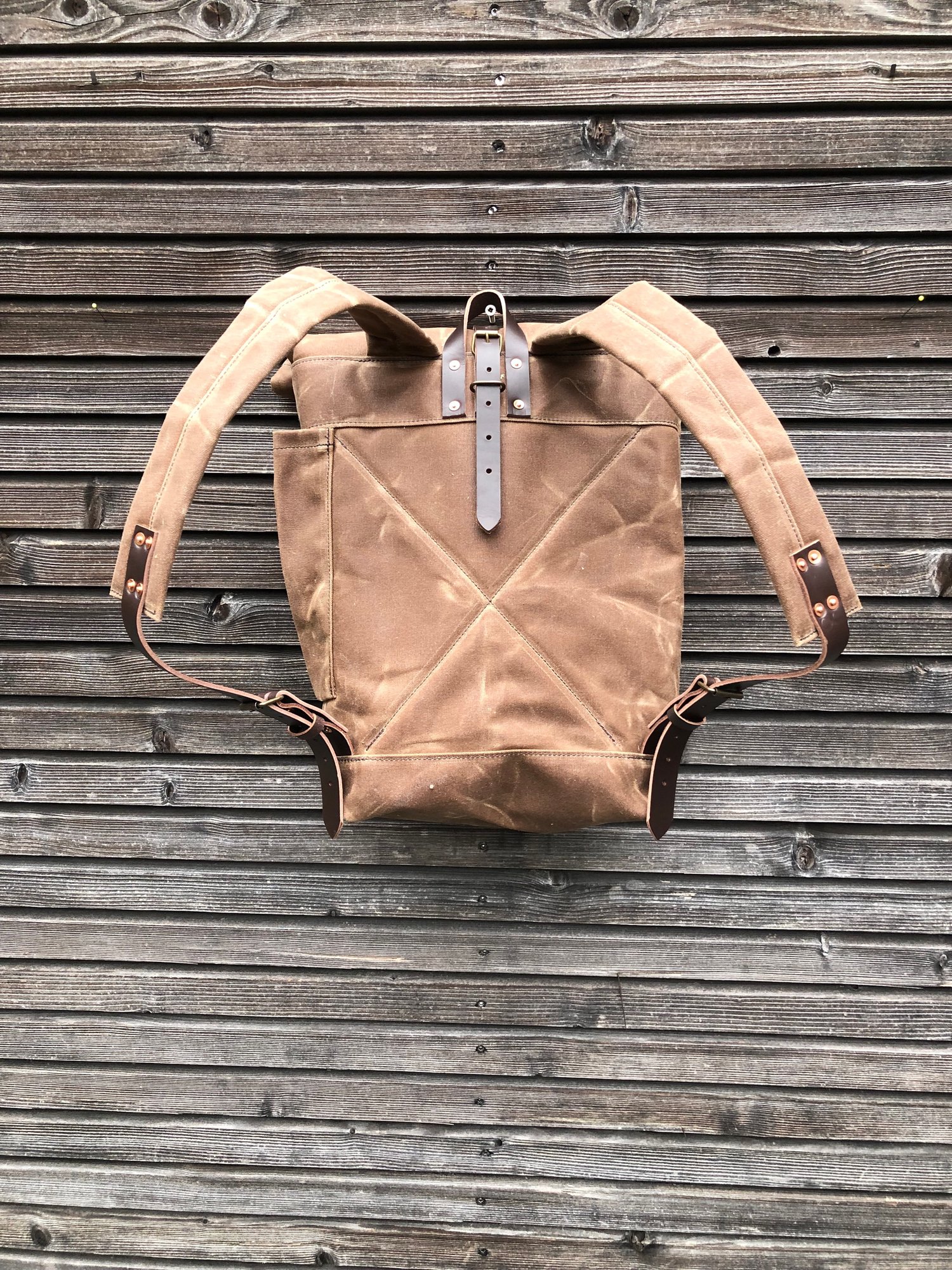 Image of Waxed canvas rucksack / waterproof backpack with roll up top and double waxed bottom