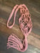 Image of Pink macrame wine bottle holder