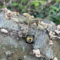 Image of “Winking” Black & Gold Necklace