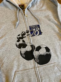 Image of footy zip-up