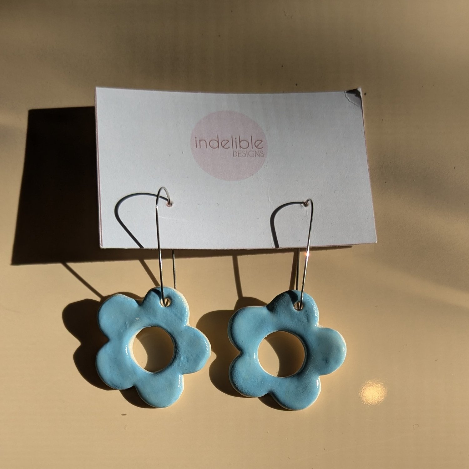 Image of baby blue daisy earrings