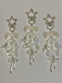 Image 1 of opal star metal bow charm