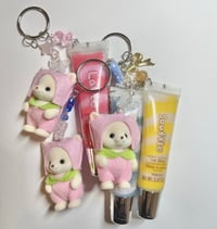 Image 1 of calico critter lipgloss keychains