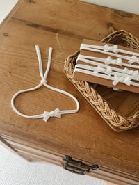 Image 1 of Simple white bow