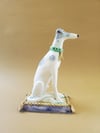 Seated hound (white and fawn)