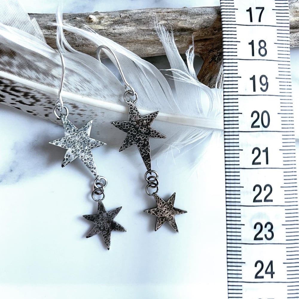 Handmade silver cosmic star dangly earrings. Celestial silver starry earrings.