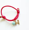 RED INITIAL CHARM PARACORD BRACELET
