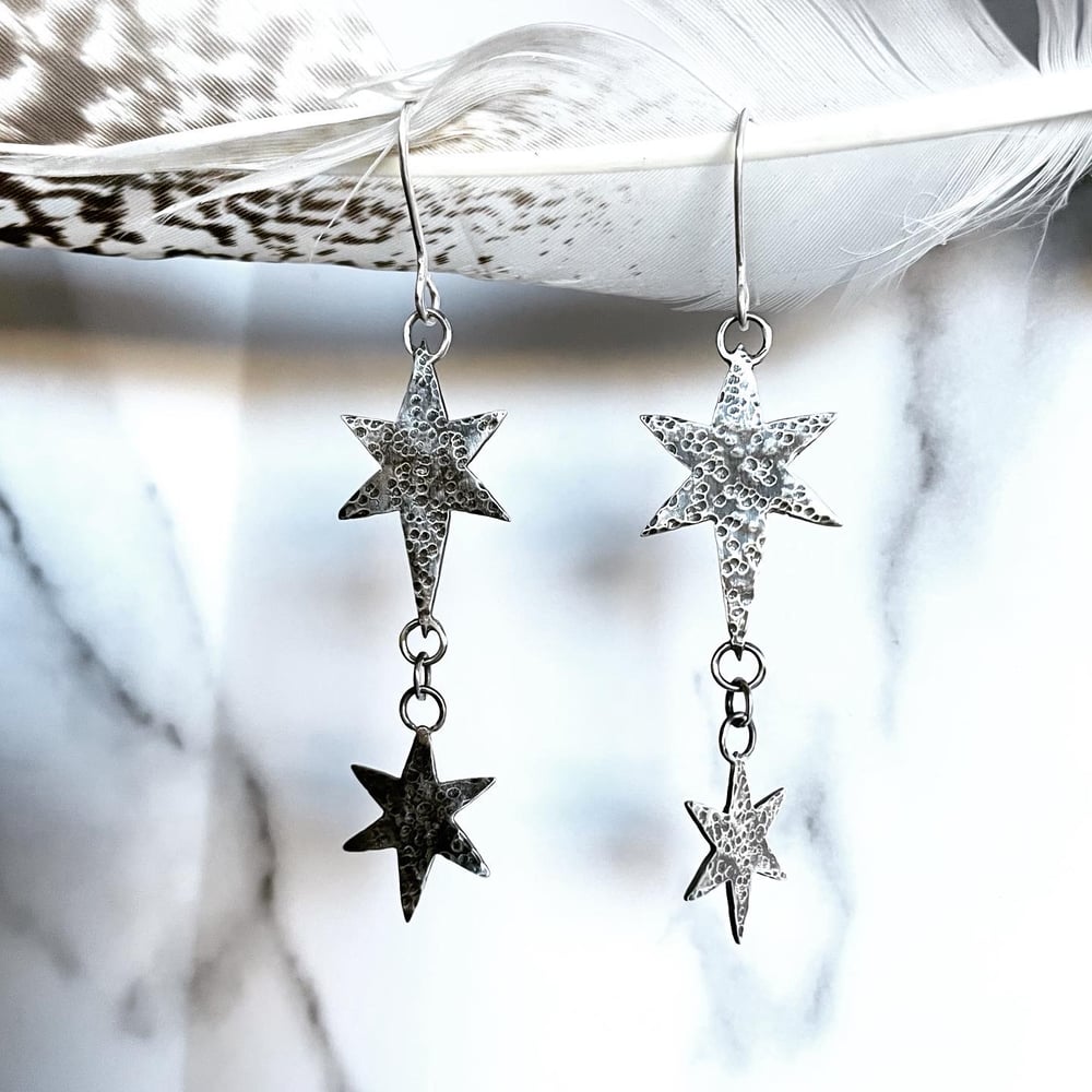 Handmade silver cosmic star dangly earrings. Celestial silver starry earrings.
