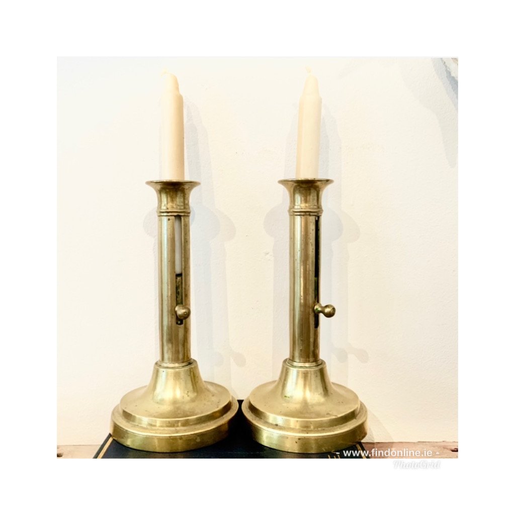 A pair of Georgian brass candlesticks 
