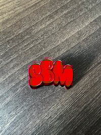 SBM Red and Gold pin