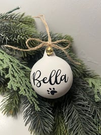 Image 1 of Personalised pet bauble with paw print