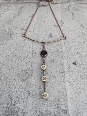 3 bullet casings and black stone necklace 