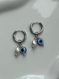 Image 1 of Stainless Steel Evil Eye Huggies