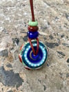 blue times; effetre glass medallion on cord