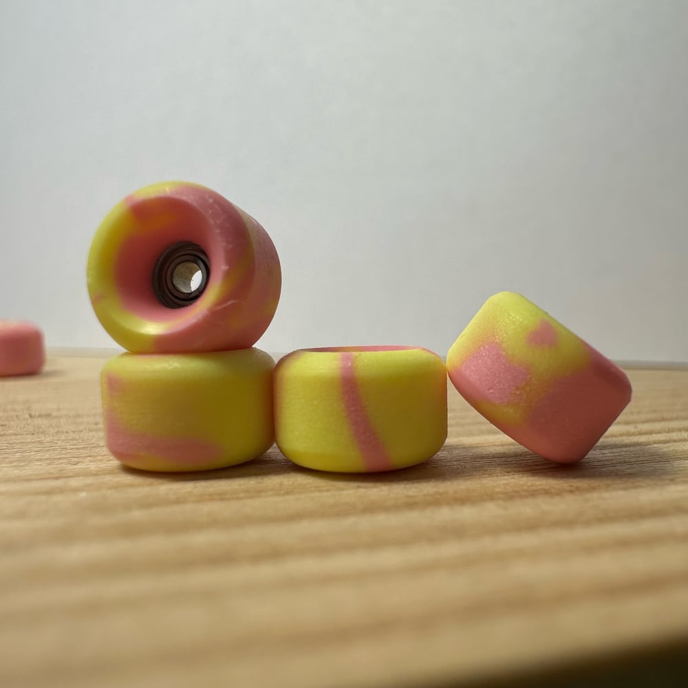 Image of pink/yellow swirl wheels 
