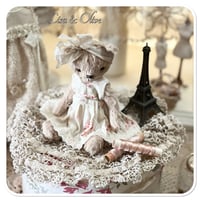 Image 2 of Handmade beige teddy bear wearing a pretty floral dress.