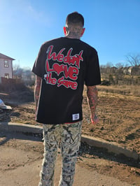 Image 1 of We dont love the same tee