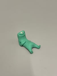 Image 1 of happy relaxed green thing