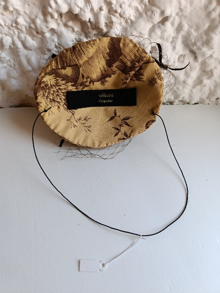 Image of Fascinator nido di fiocchi
