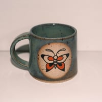 Image of Turquoise stoneware mug butterfly