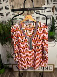 Image 1 of printed zipper front top