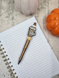 Image 1 of Skeleton Hand Coffee Cup Pen