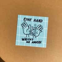 Image 2 of Eine Hand wäscht die Andere Sticker