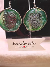 Image 3 of Handcrafted Resin Circular Monstera Leaf Earrings 