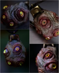 Image 1 of Egg of the King pendant, leather cord, brass hardware, all seeing glowing eyes