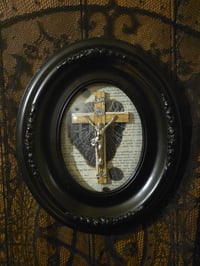 Image 1 of 2way- Black oval frame - bubble glass with preserved web, 1800s Bible page and crucifix 